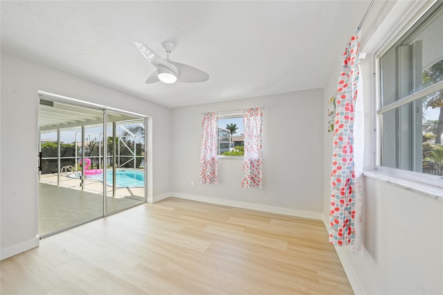 48 Hibiscus Dr, Punta Gorda, FL 33950 - unfurnished room with wood finished floors, ceiling fan, and baseboards
