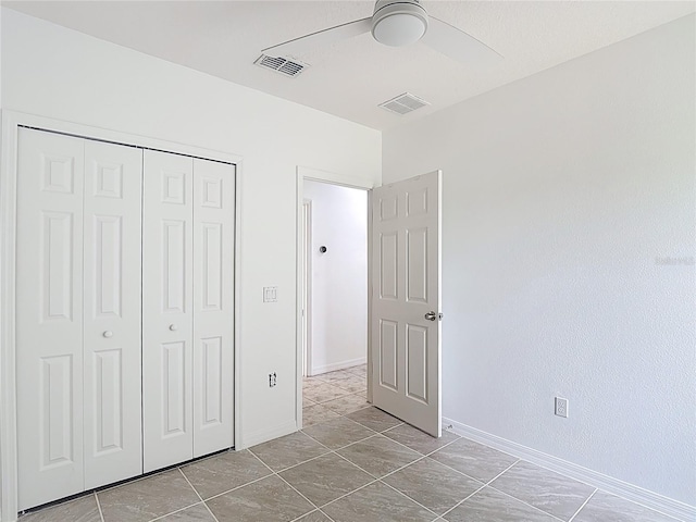 3514 Yacht Club Ct, Kissimmee, FL 34746 - unfurnished bedroom featuring visible vents, baseboards, a ceiling fan, and a closet