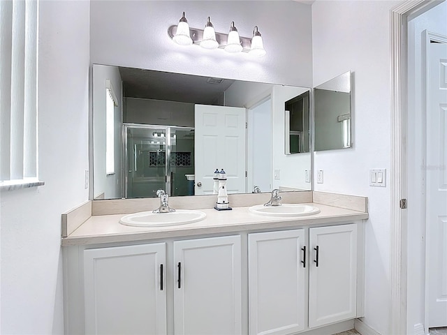 3514 Yacht Club Ct, Kissimmee, FL 34746 - bathroom featuring a shower stall, double vanity, and a sink