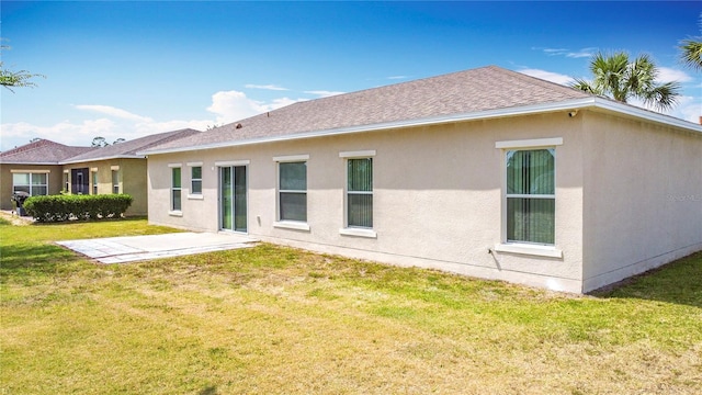 3514 Yacht Club Ct, Kissimmee, FL 34746 - back of house with a lawn, a shingled roof, stucco siding, and a patio area