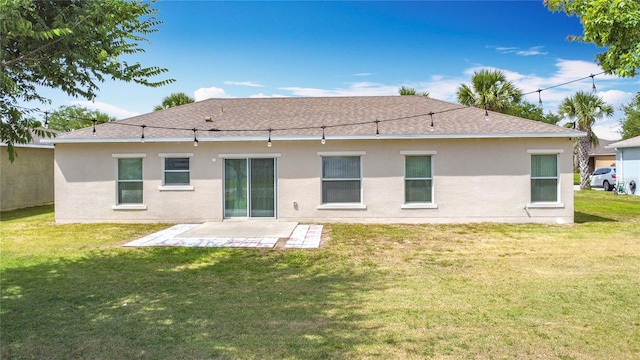 3514 Yacht Club Ct, Kissimmee, FL 34746 - rear view of house with a lawn, a patio area, a shingled roof, and stucco siding