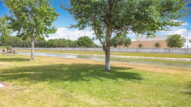 3514 Yacht Club Ct, Kissimmee, FL 34746 - view of yard with a water view and fence