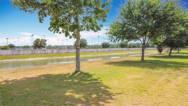 3514 Yacht Club Ct, Kissimmee, FL 34746 - view of yard with a water view and fence