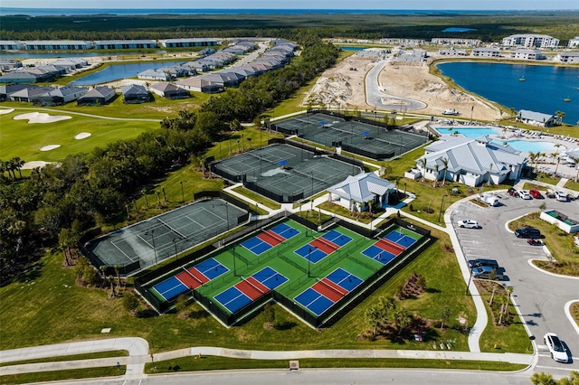 bird's eye view with a residential view, a water view, and view of golf course