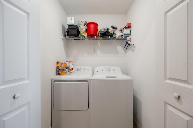 laundry room with washer and clothes dryer and laundry area