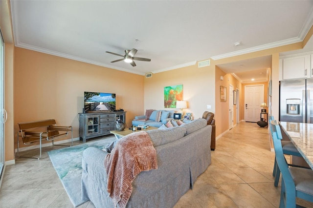 living area featuring ornamental molding, visible vents, ceiling fan, and light tile patterned floors