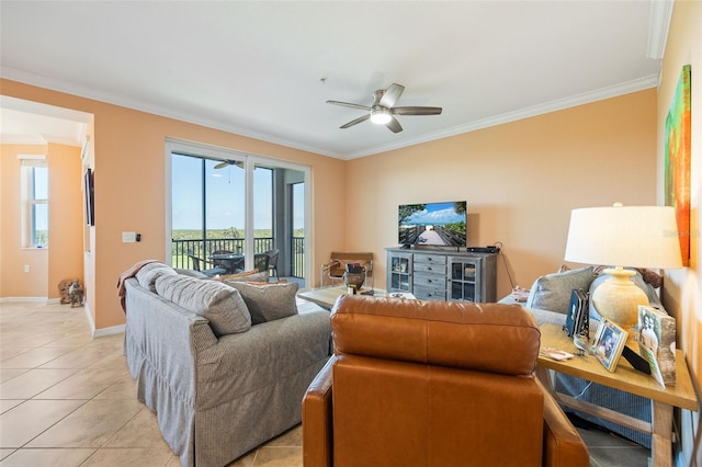 living area featuring ornamental molding, ceiling fan, light tile patterned floors, and baseboards