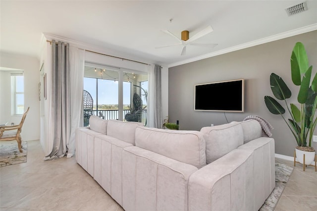 living area with crown molding, ceiling fan, and visible vents
