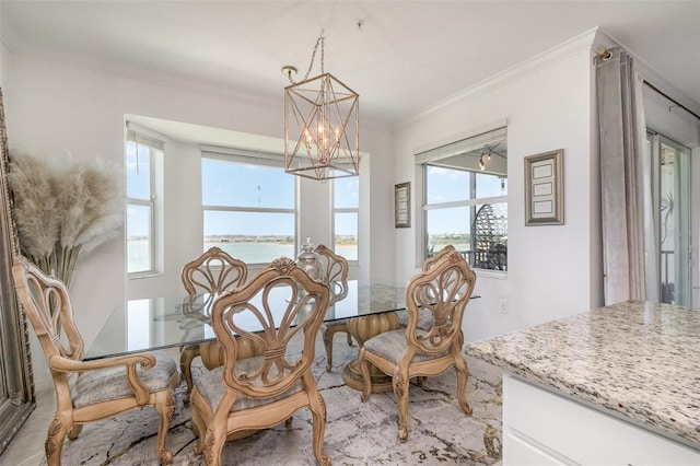 dining area featuring an inviting chandelier and ornamental molding