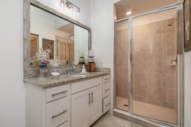 full bathroom with vanity and a shower stall