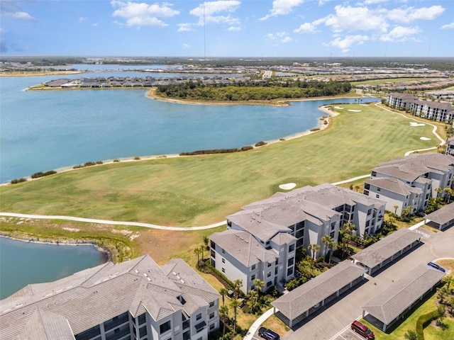 aerial view featuring a water view and view of golf course