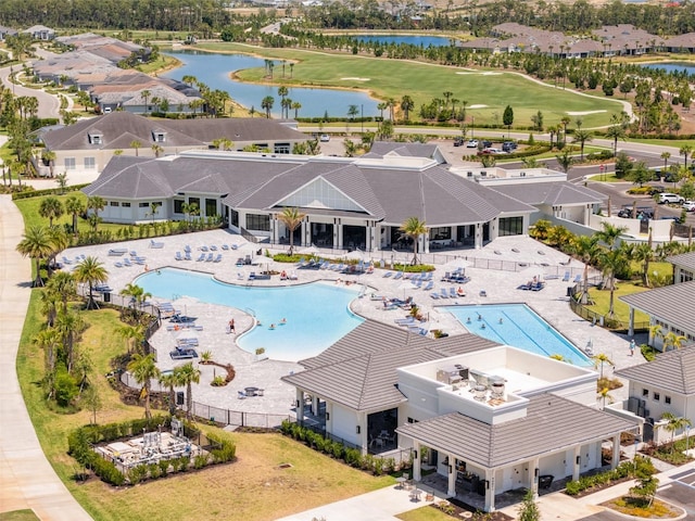 birds eye view of property with a water view, golf course view, and a residential view