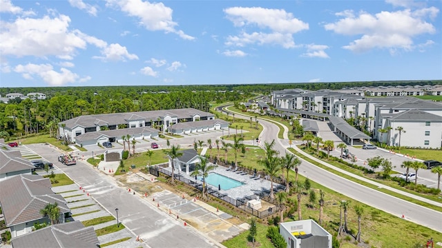 birds eye view of property with a residential view