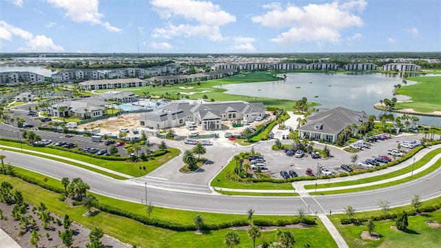bird's eye view with a water view and golf course view