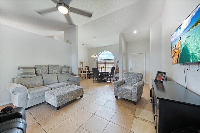 2751 S Cranberry Blvd, North Port, FL 34286 - living area featuring high vaulted ceiling, a ceiling fan, light tile patterned flooring, and a chandelier