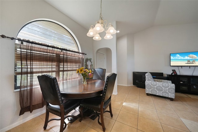 2751 S Cranberry Blvd, North Port, FL 34286 - tiled dining room with arched walkways, lofted ceiling, a chandelier, and baseboards
