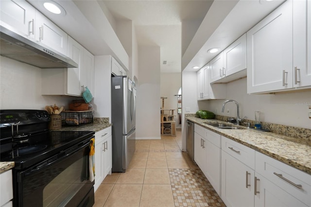 2751 S Cranberry Blvd, North Port, FL 34286 - kitchen with stainless steel appliances, under cabinet range hood, a sink, white cabinets, and recessed lighting