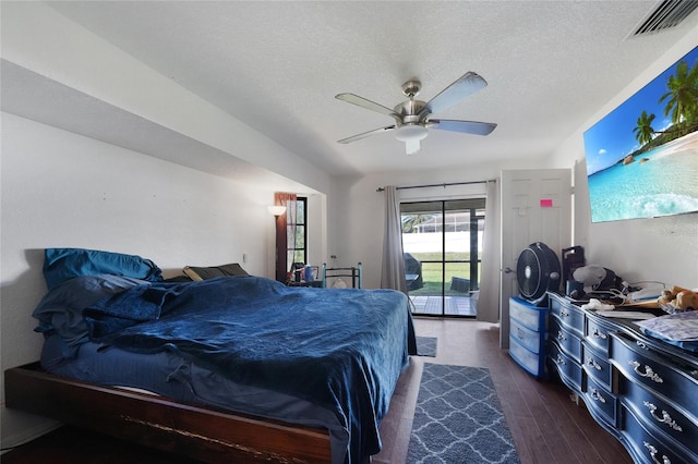 2751 S Cranberry Blvd, North Port, FL 34286 - bedroom with access to exterior, dark wood-type flooring, a textured ceiling, and ceiling fan