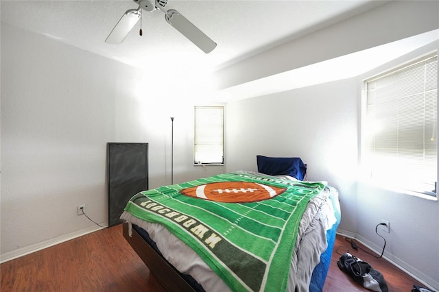 2751 S Cranberry Blvd, North Port, FL 34286 - bedroom with wood finished floors, ceiling fan, and baseboards