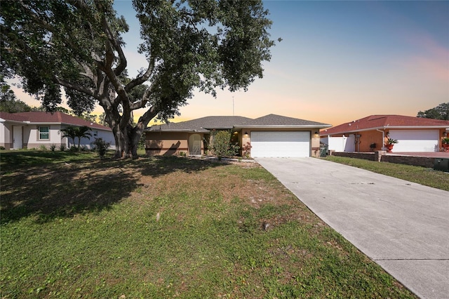 2751 S Cranberry Blvd, North Port, FL 34286 - single story home with a garage, driveway, and a front lawn