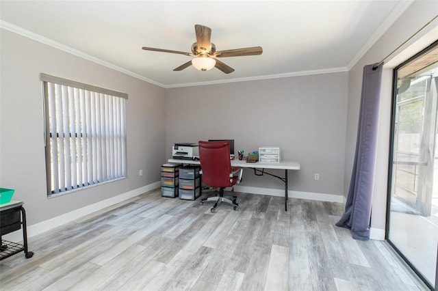 office space with crown molding, a ceiling fan, wood finished floors, and baseboards