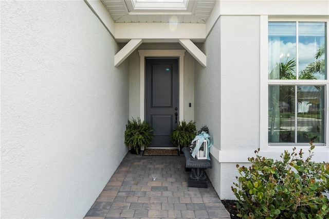 15830 Appalachian Dr, Punta Gorda, FL 33982 - view of exterior entry featuring stucco siding