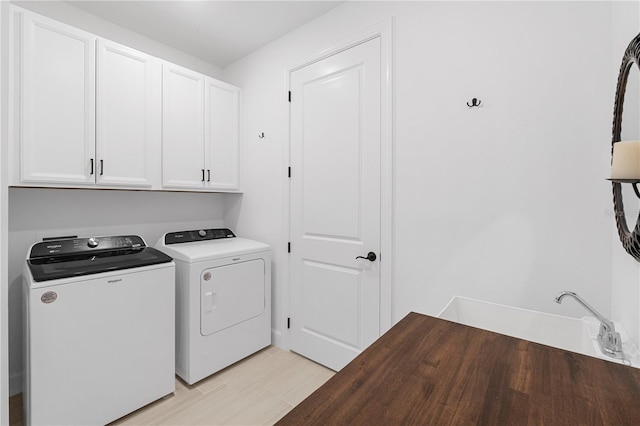 15830 Appalachian Dr, Punta Gorda, FL 33982 - laundry room with cabinet space and independent washer and dryer
