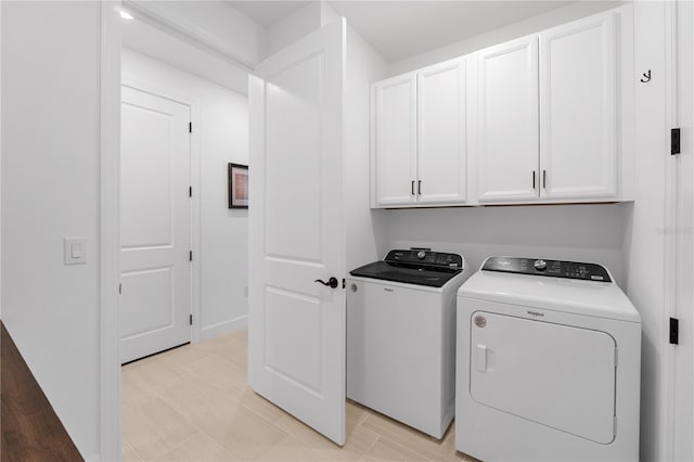 15830 Appalachian Dr, Punta Gorda, FL 33982 - clothes washing area with cabinet space and washer and clothes dryer