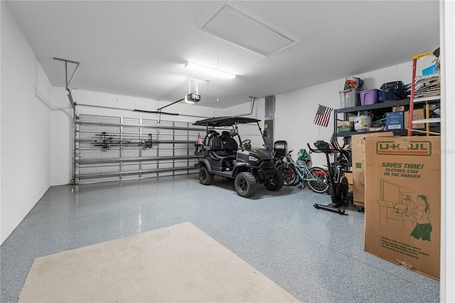 15830 Appalachian Dr, Punta Gorda, FL 33982 - garage featuring a garage door opener and concrete block wall