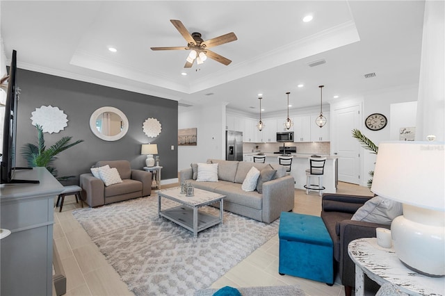 15830 Appalachian Dr, Punta Gorda, FL 33982 - living room featuring a ceiling fan, a tray ceiling, recessed lighting, and visible vents