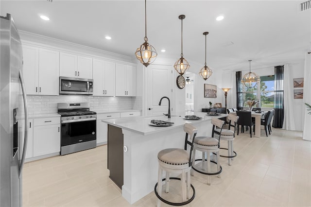15830 Appalachian Dr, Punta Gorda, FL 33982 - kitchen with light countertops, decorative backsplash, stainless steel appliances, and a kitchen breakfast bar