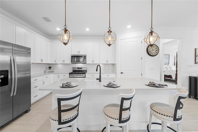15830 Appalachian Dr, Punta Gorda, FL 33982 - kitchen featuring appliances with stainless steel finishes, decorative backsplash, and white cabinets