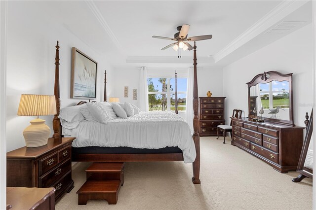 15830 Appalachian Dr, Punta Gorda, FL 33982 - bedroom featuring crown molding, ceiling fan, a tray ceiling, and light colored carpet