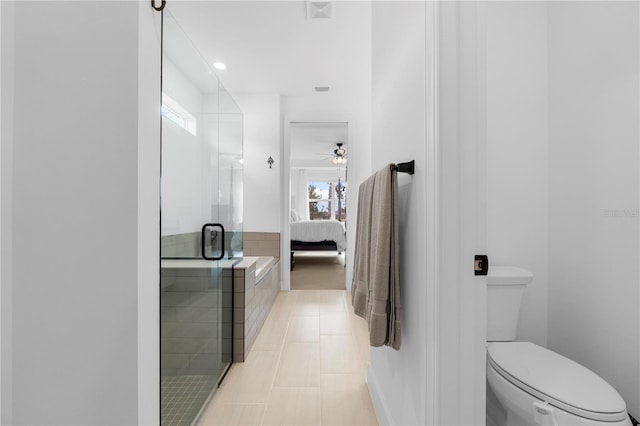 15830 Appalachian Dr, Punta Gorda, FL 33982 - bathroom with connected bathroom, toilet, tile patterned floors, a ceiling fan, and a stall shower