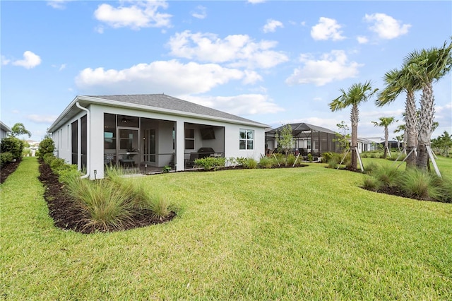 15830 Appalachian Dr, Punta Gorda, FL 33982 - rear view of property featuring a sunroom and a yard