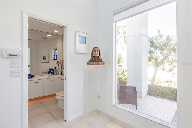 bathroom featuring baseboards, toilet, recessed lighting, tile patterned floors, and vanity