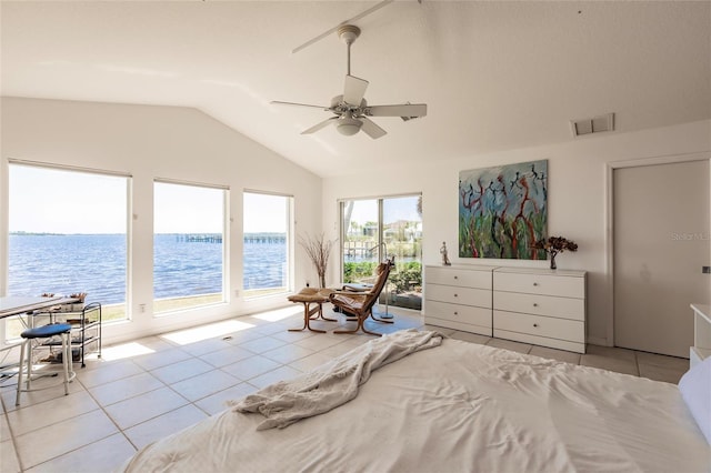 tiled bedroom with access to outside, a water view, visible vents, a ceiling fan, and lofted ceiling
