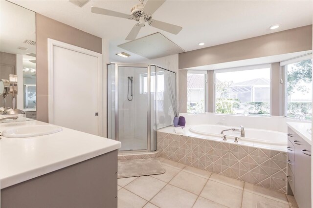 full bath featuring a shower stall, vanity, a bath, ceiling fan, and tile patterned floors