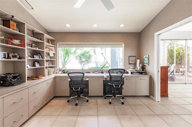 home office with recessed lighting, a ceiling fan, light tile patterned flooring, and built in desk