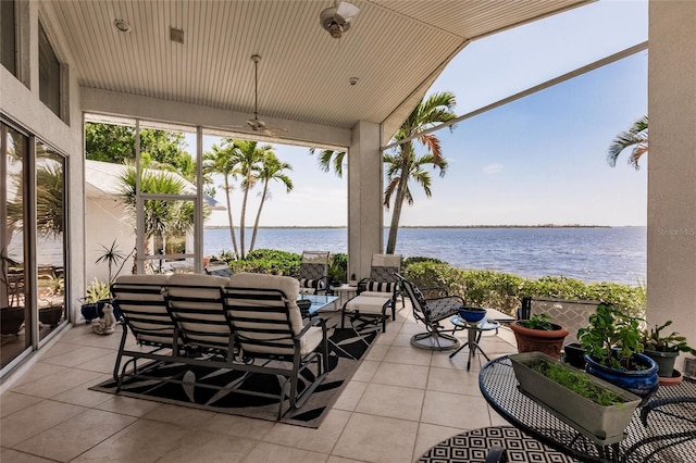 view of patio featuring a water view and an outdoor living space