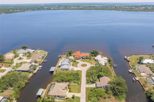 bird's eye view with a residential view and a water view