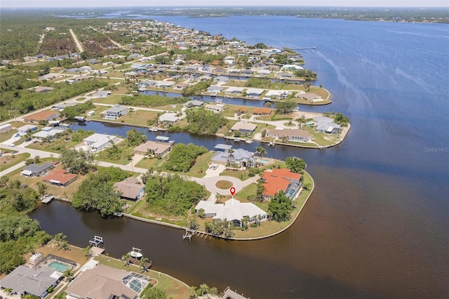 drone / aerial view with a water view and a residential view
