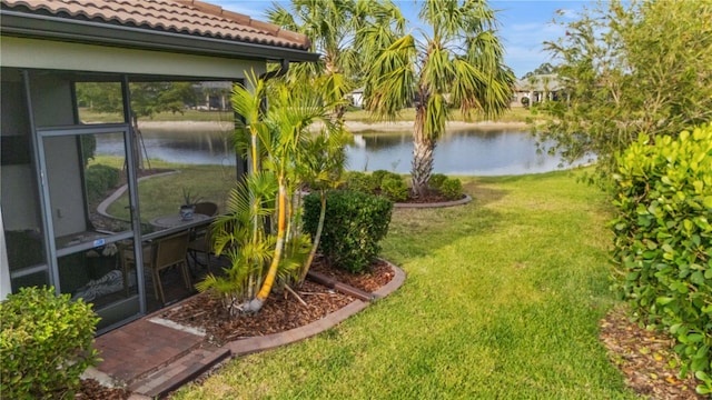 1745 Hyssop Loop, North Port, FL 34289 - view of grassy yard with a water view and a sunroom
