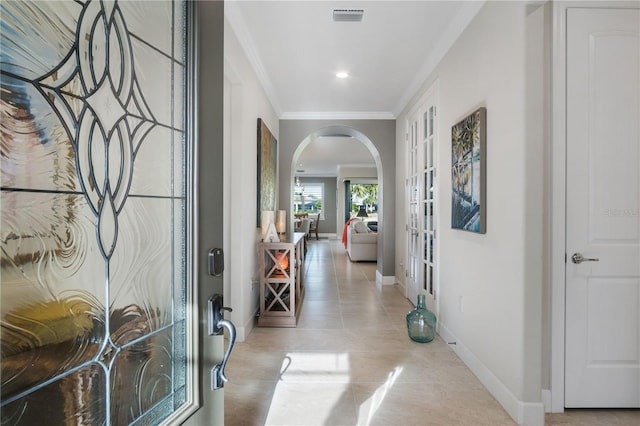 1745 Hyssop Loop, North Port, FL 34289 - entryway with arched walkways, crown molding, baseboards, french doors, and tile patterned flooring
