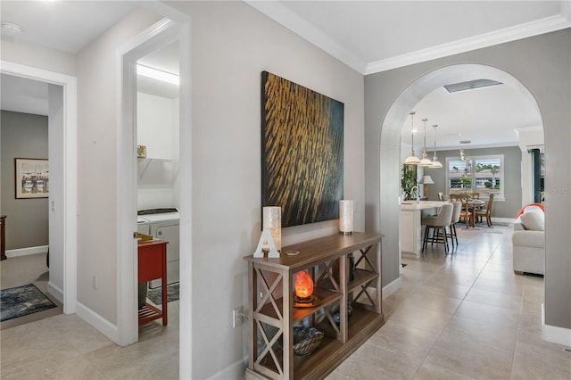 1745 Hyssop Loop, North Port, FL 34289 - corridor with arched walkways, ornamental molding, tile patterned flooring, and baseboards