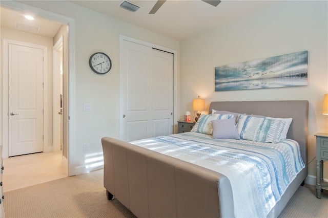 1745 Hyssop Loop, North Port, FL 34289 - bedroom featuring light colored carpet, a closet, and ceiling fan