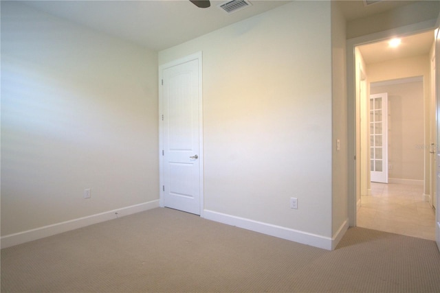 1745 Hyssop Loop, North Port, FL 34289 - unfurnished bedroom with light colored carpet and baseboards