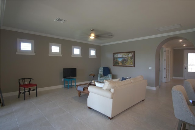 1745 Hyssop Loop, North Port, FL 34289 - living room featuring arched walkways, crown molding, a ceiling fan, and light tile patterned floors