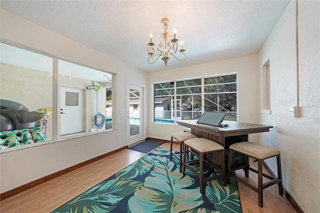 sunroom with a chandelier