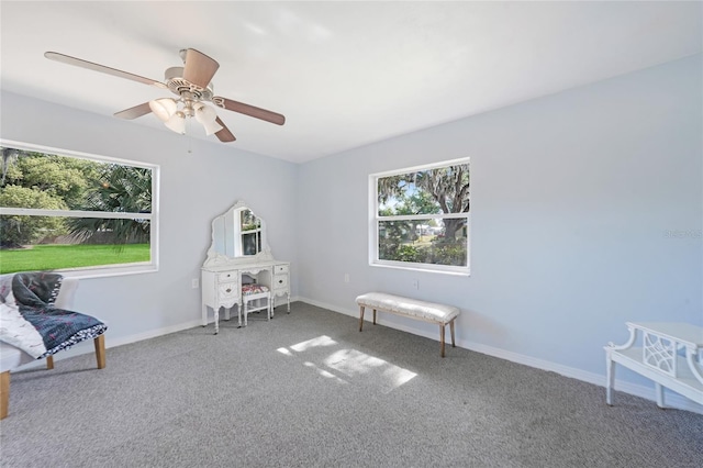recreation room featuring baseboards, ceiling fan, and carpet flooring